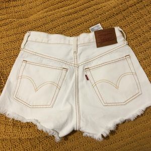 Levi’s beige with brown stitching